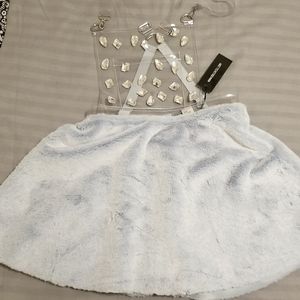 Overalls skirt, baby blue, with jewels and a front pocket. From dollskill